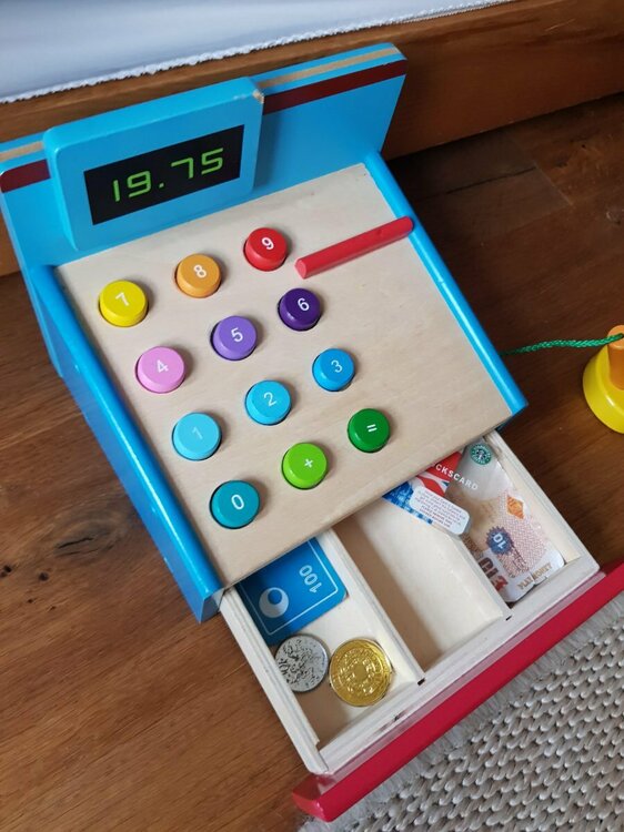 wooden cash register and money.jpg