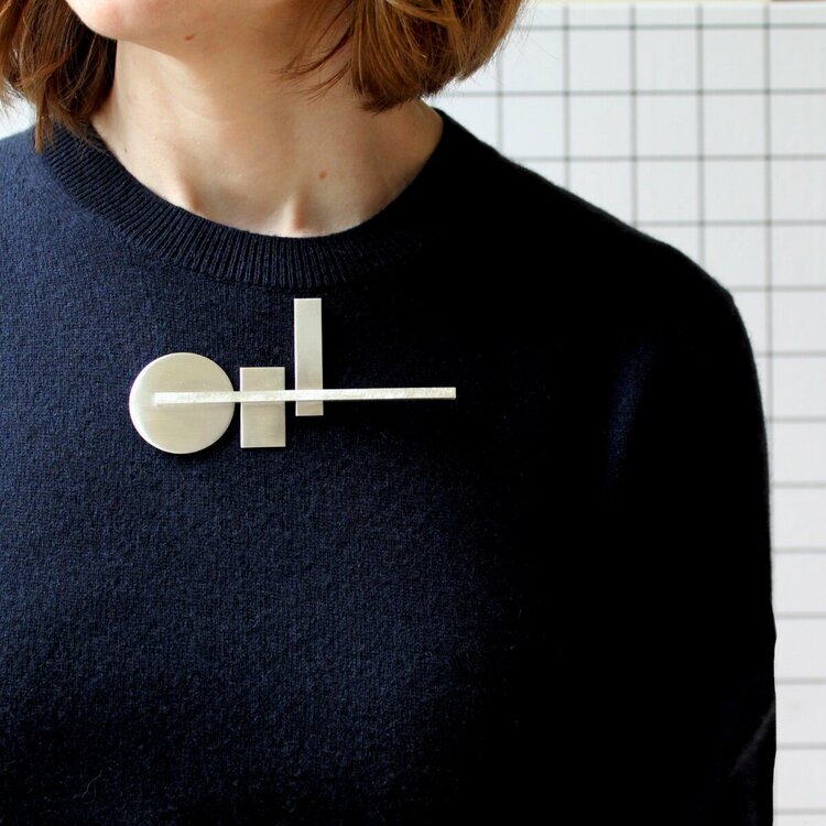 Poppy Norton - silver buttonhole brooch horizontal - high res on model .jpg