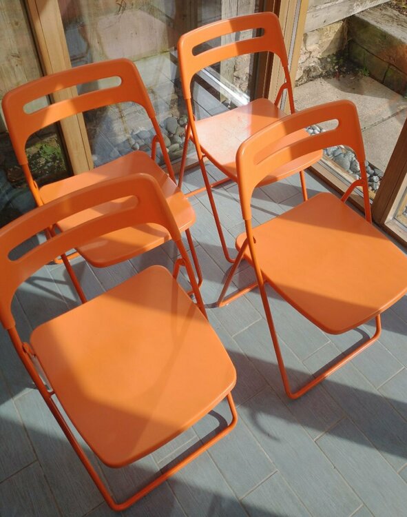 orange folding chairs.jpg
